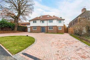 Drive way leading up to a grande home