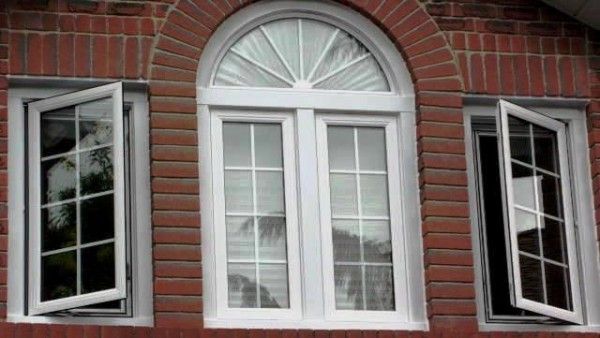 ARCHED SASH WINDOWS IN CENTRE AND TWO GEORGIAN BAR SASH WINDOWS TO EITHER SIDE