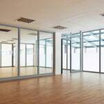 Full height glazed partition in grey