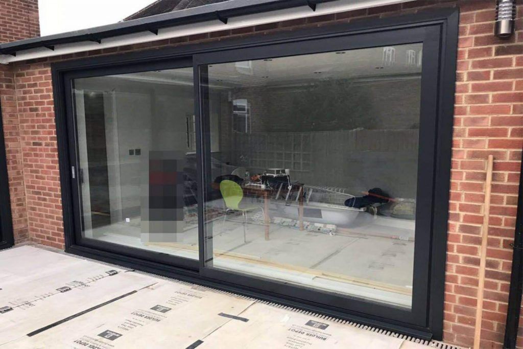 Large black aluminium sliding doors fitted in chelsea and kensington home