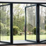 Bi-folding doors in grey aluminum